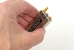 CST-702 compared to the size of a hand