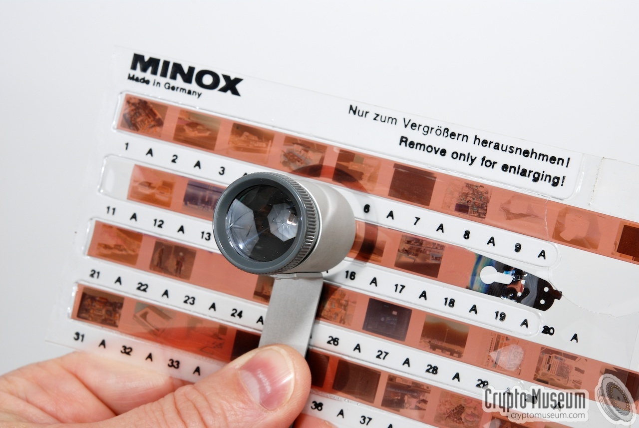 Using the loupe to view negatives inside Minox film folder