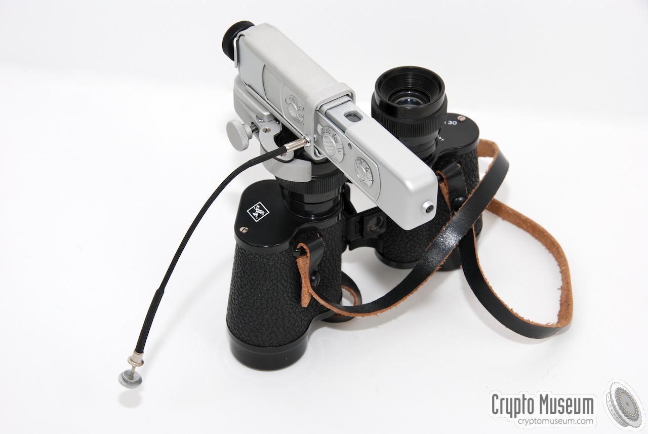 A Minox C camera sitting on top of Agfa binoculars