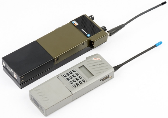 The SE-20 next to its much smaller successor, the SE-160C, which featured digital encryption.