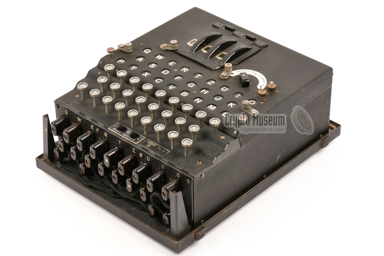 Enigma machine bolted to the bottom of a Panzerholz case