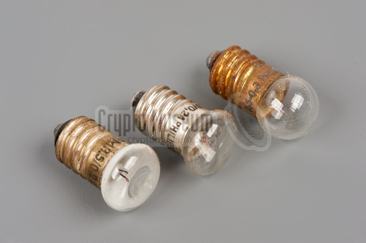 Three light bulbs with E10 fitting. The two on the left are flattened.