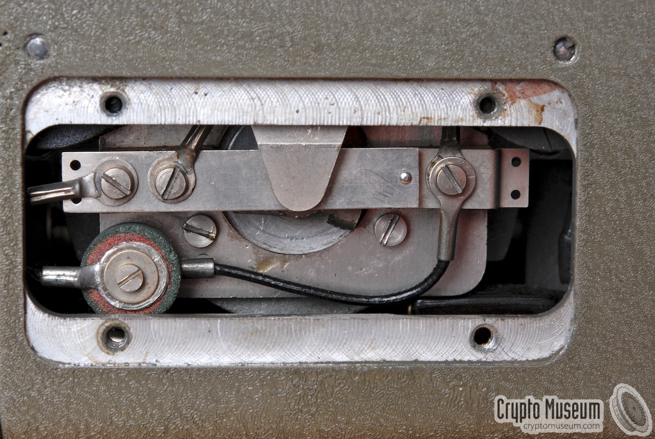 The varistor mounted below the centrifugal switch, seen from the rear of the machine, after removing a small panel.