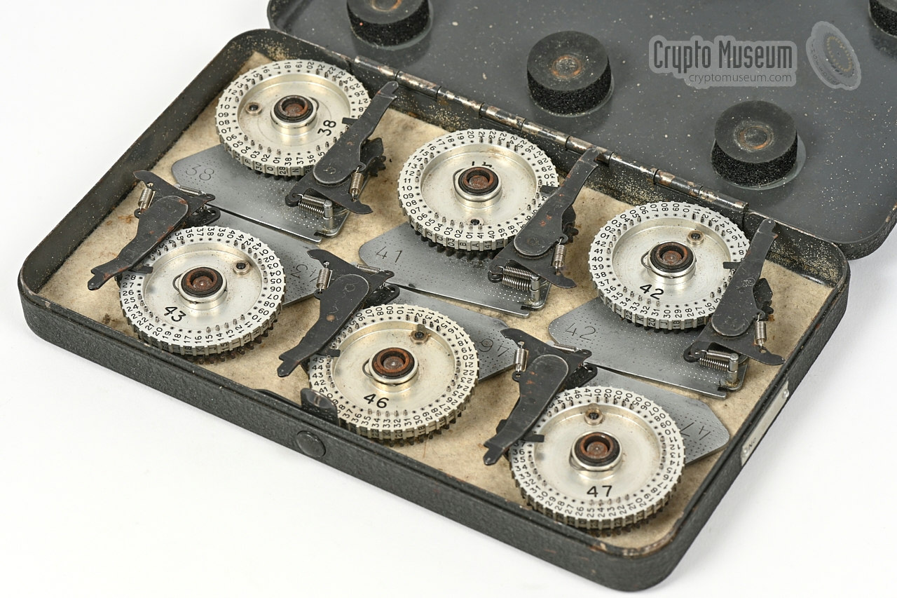 Six additional pin-wheels in metal storage case