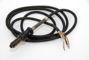 The data cable that connects to the teleprinter and the telex line