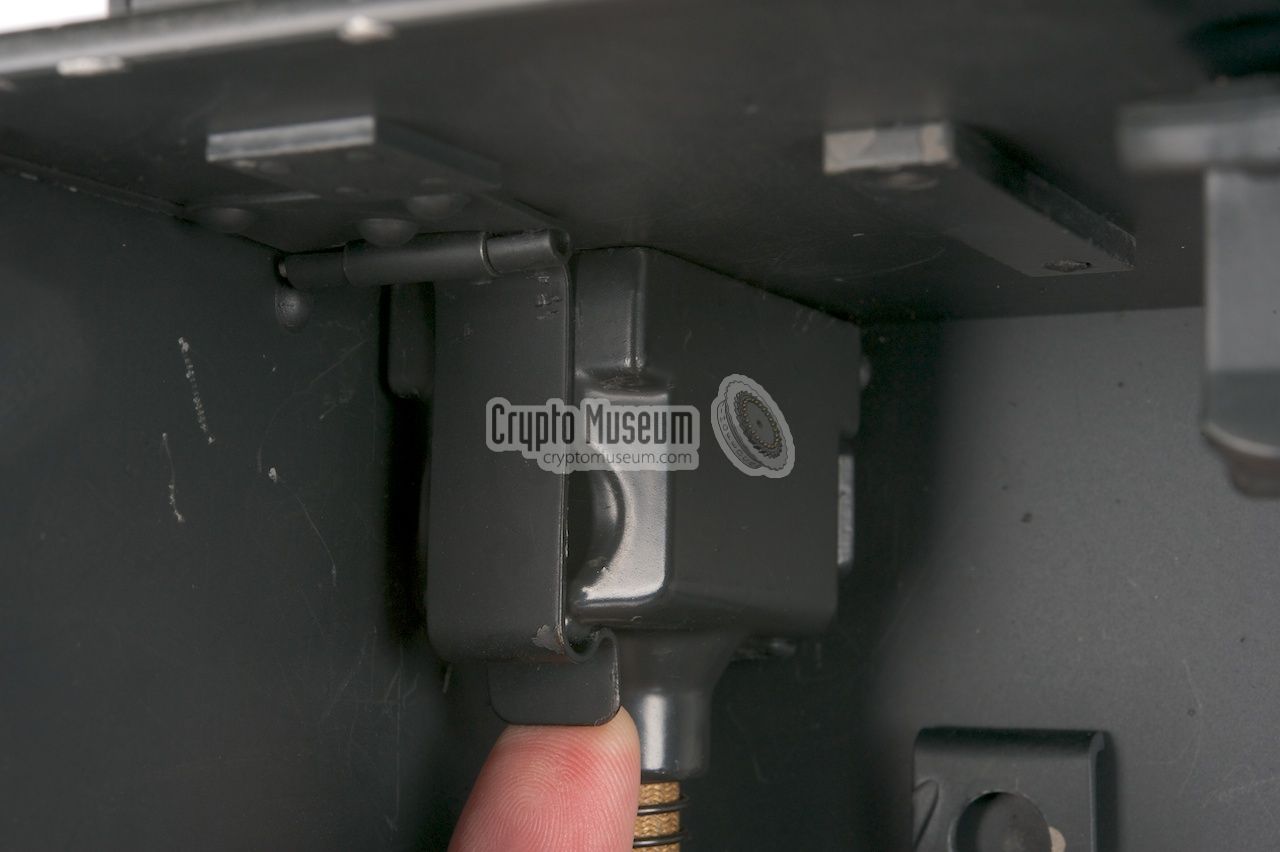 Unlocking one of the connectors of the expansion cable from the case lid