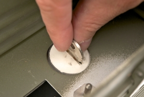 Removing the spare key from the hidden compartment