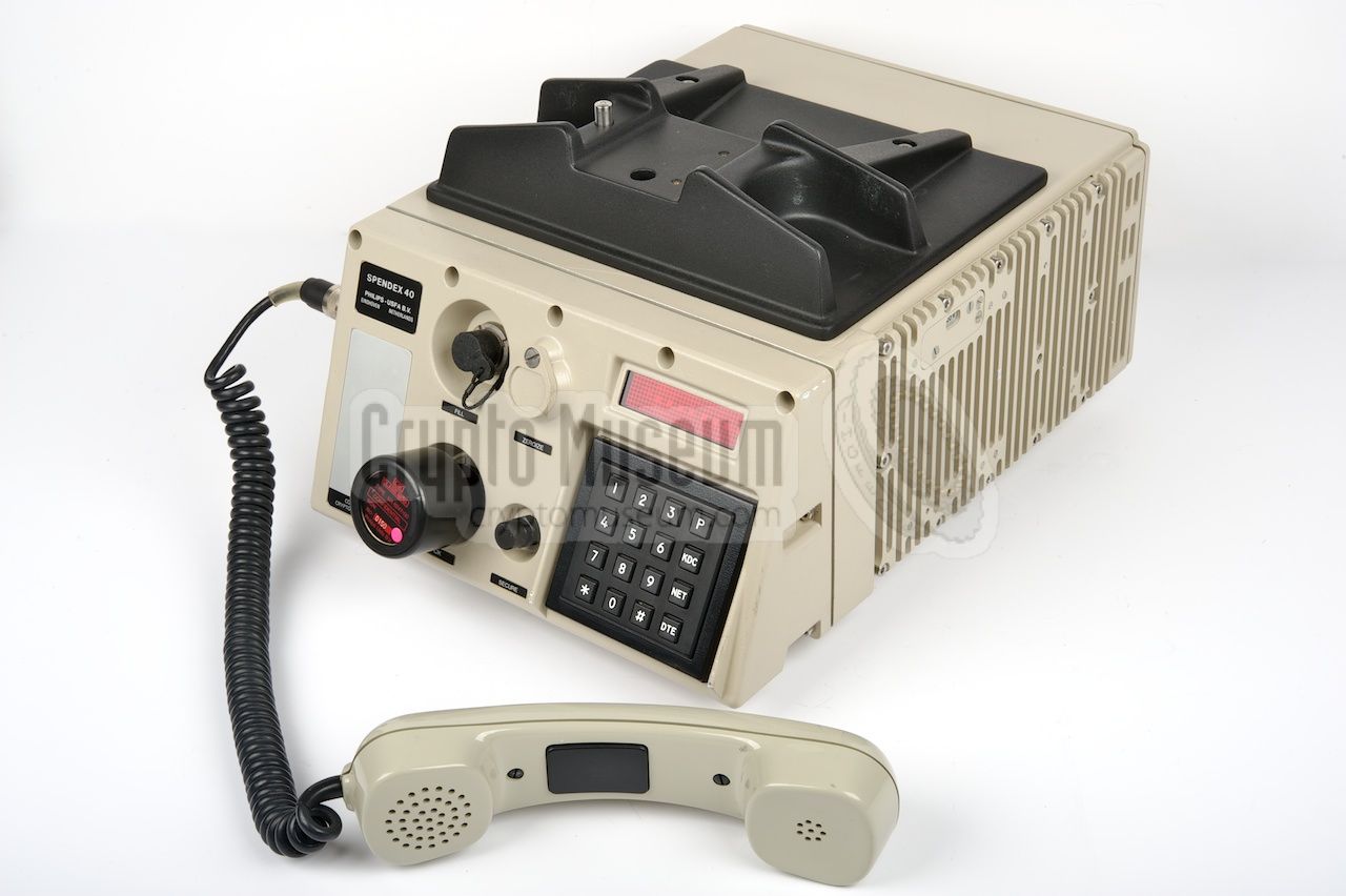 Spendex 40 with the handset off-hook, showing the PTT-switch which is used for half-duplex operation.