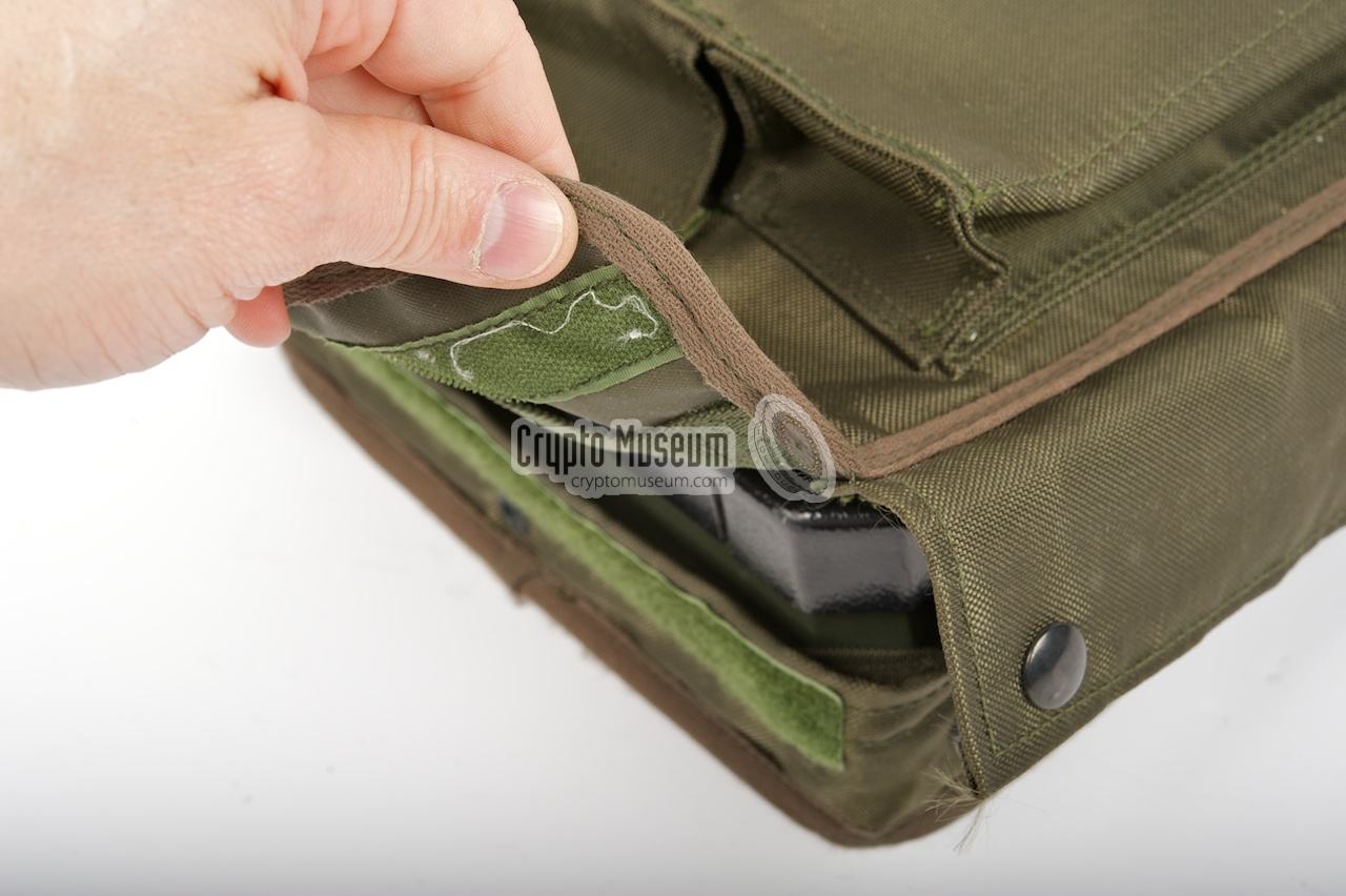 Closing the velcro edges of the carrying pouch