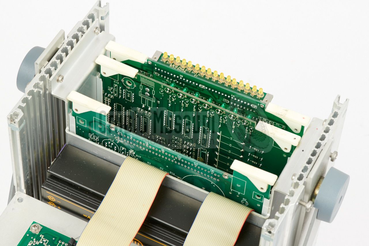 Three PCBs slotted into the backplane
