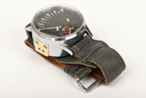 Field strength indicator disguised as wristwatch. Note the two-pin socket at the left side