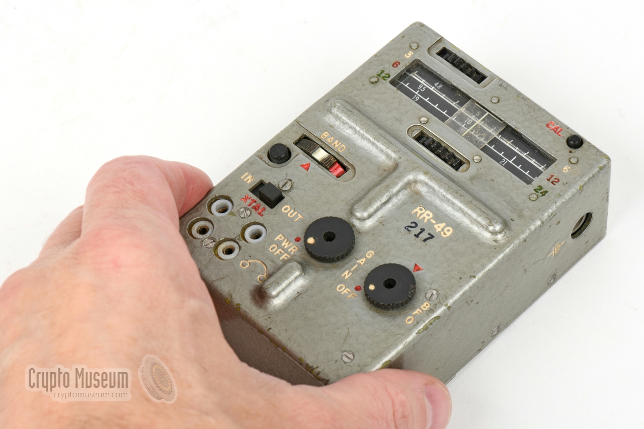 RR-49 receiver compared to the size of a hand